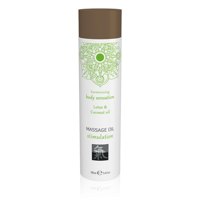 A bottle of SHIATSU Massage Oil with Lotus & Coconut Oil scented, 100 ml size. The packaging is predominantly white with green accents and a picture of a lotus flower.