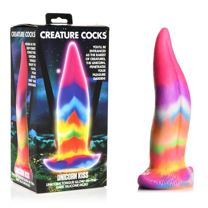 The image shows a multi-colored silicone dildo with a unicorn tongue design, placed against a black background. The dildo has a tapered shape with vibrant, rainbow-like colors.