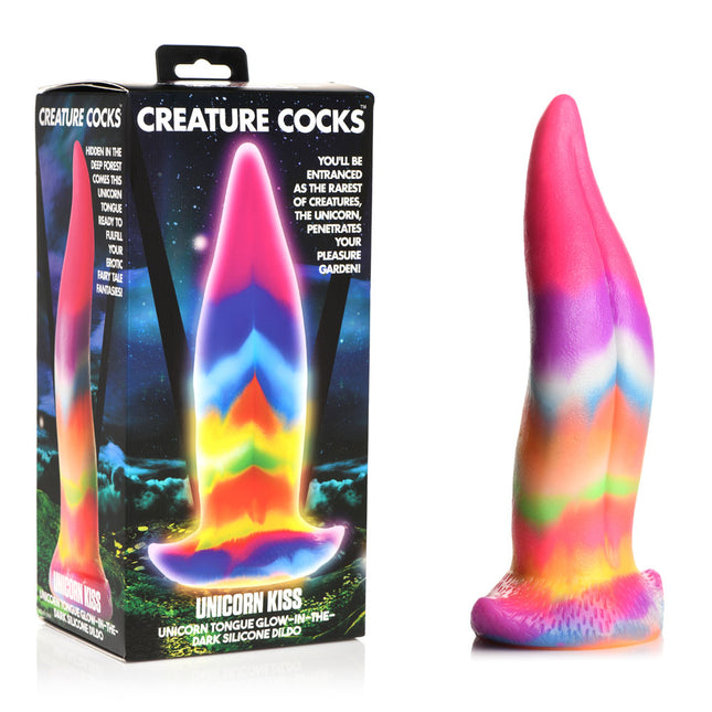 The image shows a multi-colored silicone dildo with a unicorn tongue design, placed against a black background. The dildo has a tapered shape with vibrant, rainbow-like colors.
