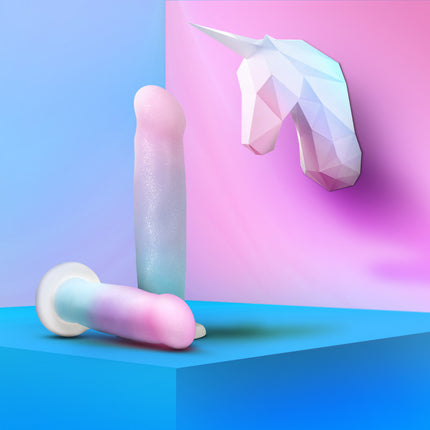 Avan D17 Lucky 8 Inch Rainbow Dildo Laying down with Unicorn on wall