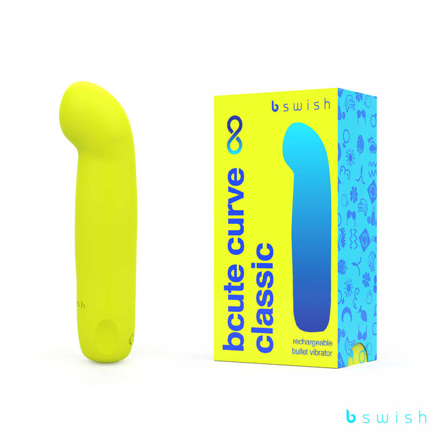 A bright citrus yellow vibrator with a curved tip, shown next to its colorful packaging labeled 'bcute curve infinite classic'.