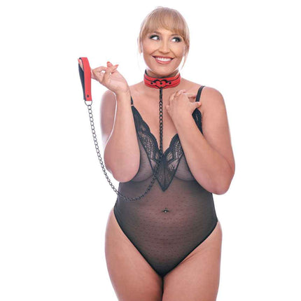 Blonde Female in Black Lingerie holding Red Collar & Leash