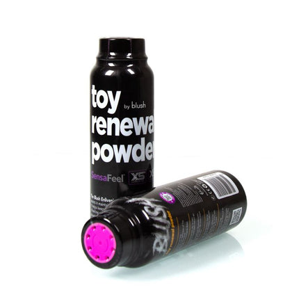 Two bottles of Blush Toy Renewal Powder, one standing upright and the other lying down, revealing the pink powder inside.