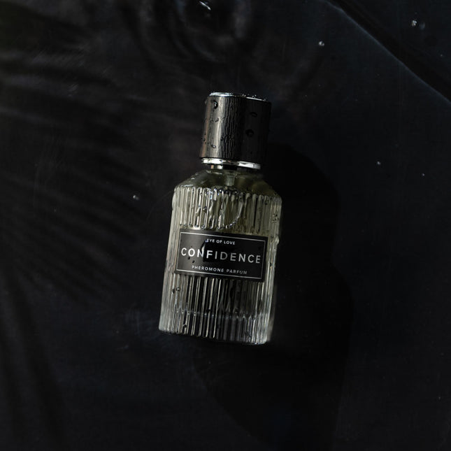 Perfume bottle labeled 'Confidence' on a dark background
