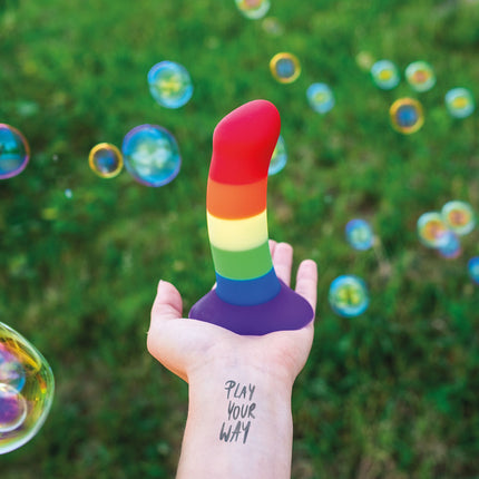 Hand holding the Fun Factory AMOR Rainbow Dildo 14.6cm 5.7 inch 