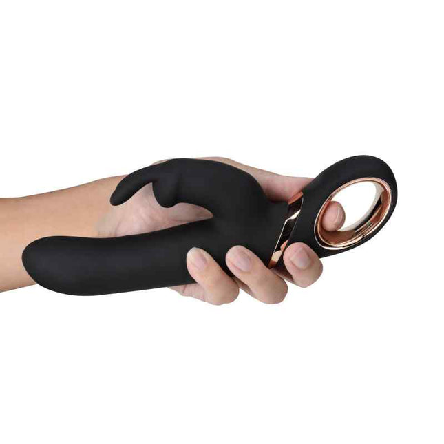 Female hand holding Black Lush Victoria Rabbit Vibrator