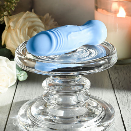 Gender X LIL BUDDY Light Blue Rechargeable Mini Bullet Vibrator Side View on Clear Stand