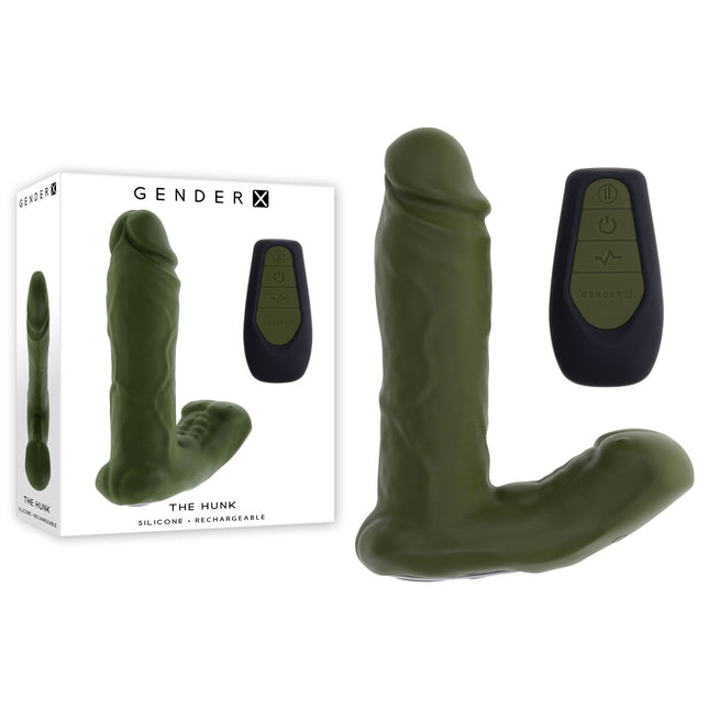 A green, dual shaft vibrator with a realistic crowned head and a hunky male torso design. The product comes with a remote control and is displayed alongside its packaging.
