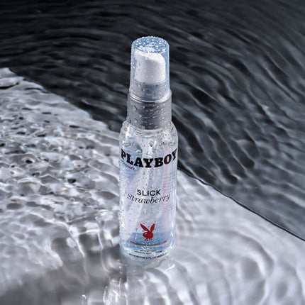 Playboy Pleasure SLICK STRAWBERRY Flavoured Water Based Lubricant - 60 ml in water background front view