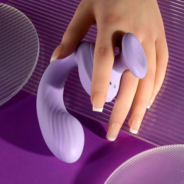 Hand holding Playboy Pleasure REV ME UP Curved G Spot Purple Vibrator
