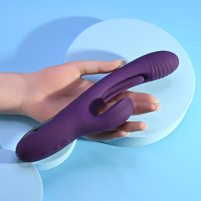 hand holding Playboy Pleasure THE THRILL Purple Rabbit Vibrator
