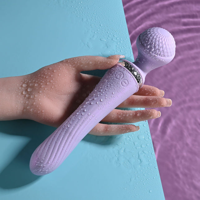 Hand holding waterproof Playboy Pleasure VIBRATO Lavender Wand Vibrator