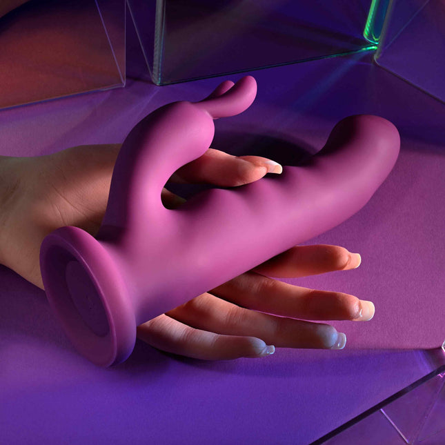 Hand holding Playboy Pleasure FLUFFLE Purple Rabbit Vibrator