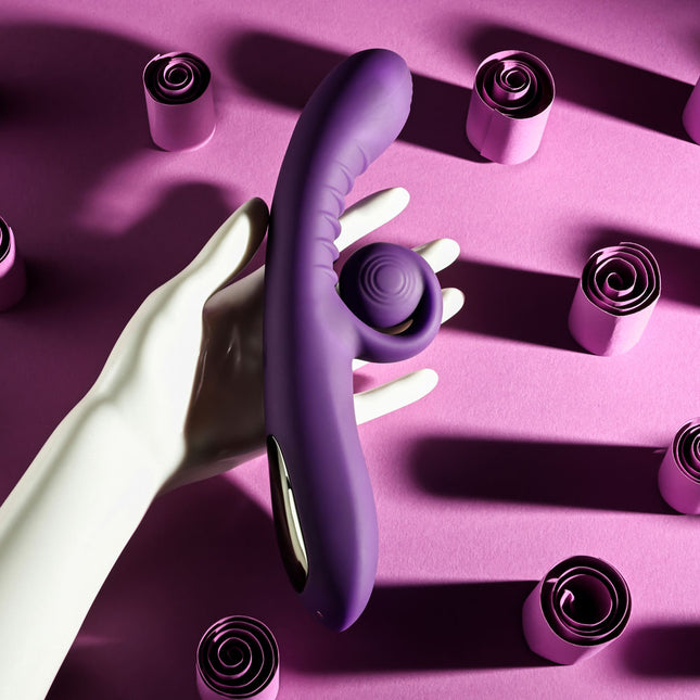 manakin hand holding Playboy CURLICUE Purple Rabbit Vibrator