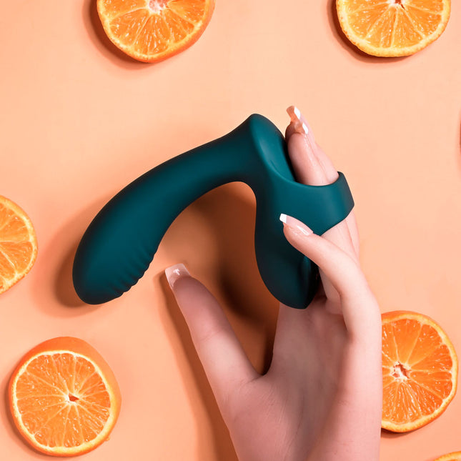 Hand holding Playboy Pleasure Wrapped Around Your Finger Vibrator