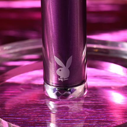 Close up of playboy logo on purple bullet vibrator