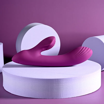 Playboy Rabbit Vibrator Purple laying on Stand