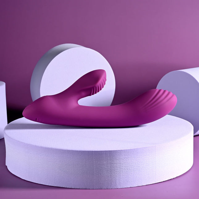 Playboy Rabbit Vibrator Purple laying on Stand