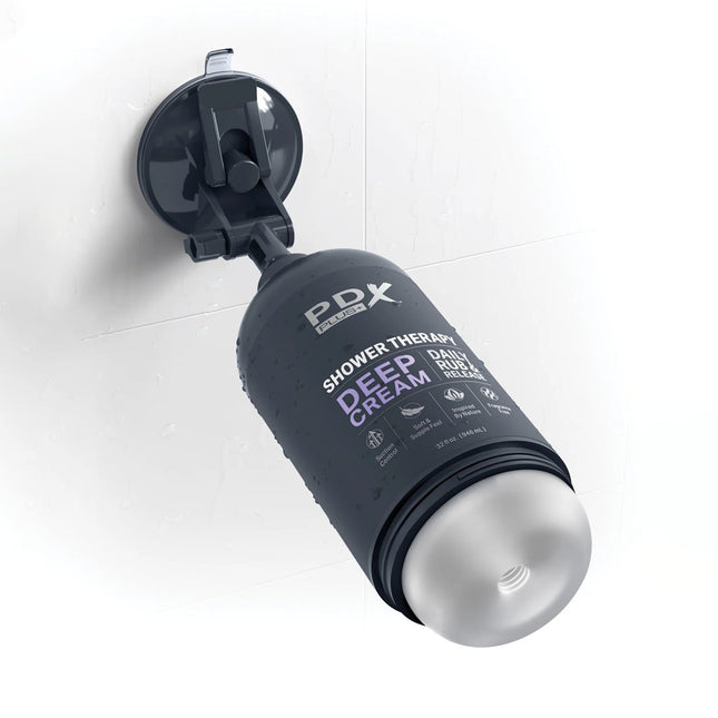 PDX Plus Shower Therapy Deep Cream Clear Discreet Stroker on a shower wall with suction hold