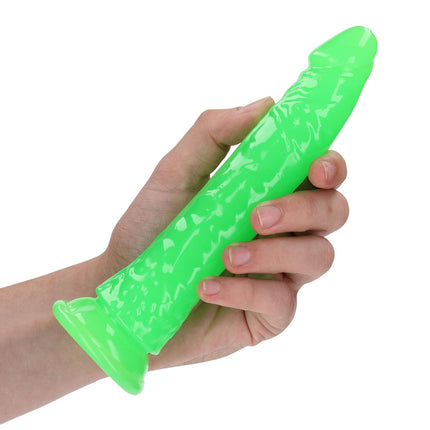 Hand holding REALROCK 7 Inch Slim Glow in the Dark Neon Green Dildo