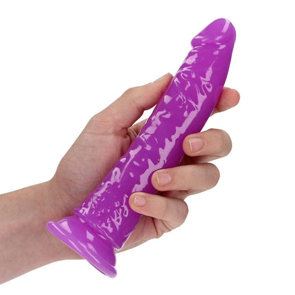 Hand Holding REALROCK 7 Inch Slim Glow in the Dark Neon Purple Dildo