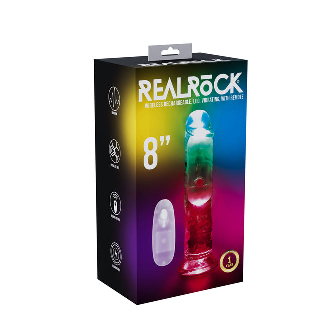 The product image shows the packaging of the RealRock 8'' vibrating dong, which is clear with LED lights. The box features colorful design elements and highlights the product's features, including its wireless and rechargeable functions.