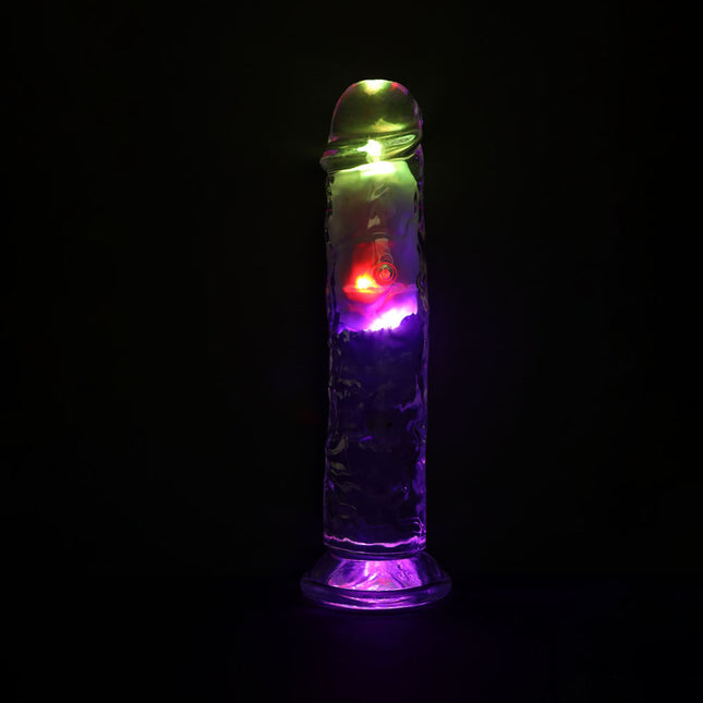 Colorful LED light-up dildo sex toy on a black background