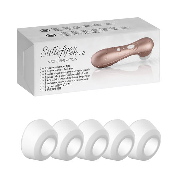 The image shows a set of five white silicone replacement heads for the Satisfyer Pro 2 Climax Tips, displayed in front of the product's packaging.