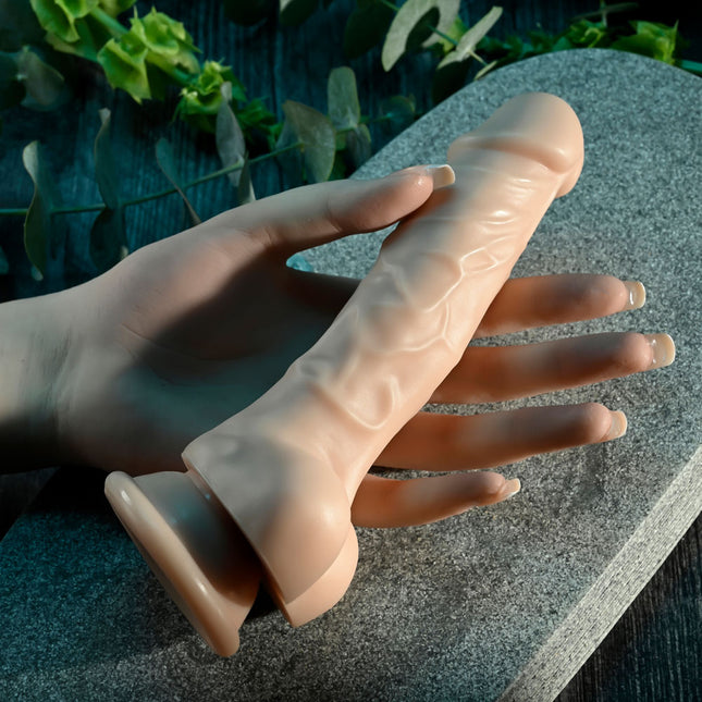 hand holding Selopa 6 Inch Light Flesh DILDO