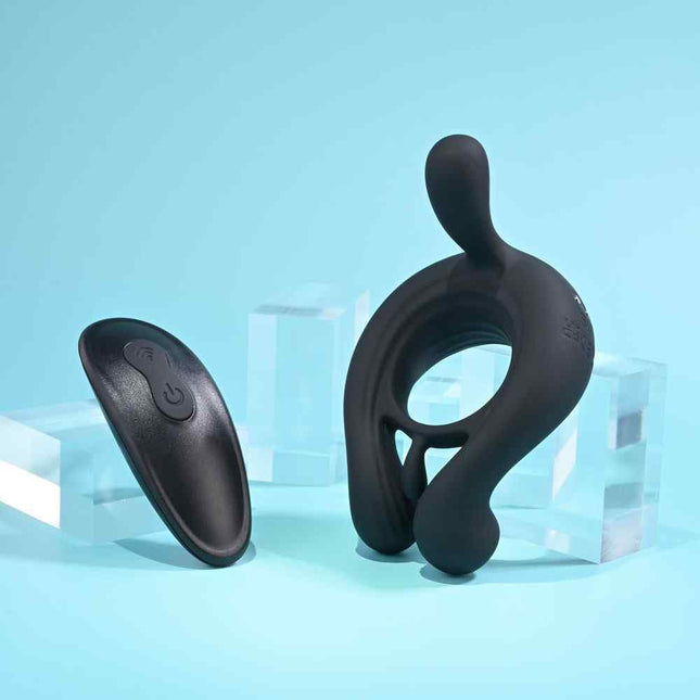 Stand holding Playboy Pleasure TRIPLE PLAY Cock Ring Black with Remote