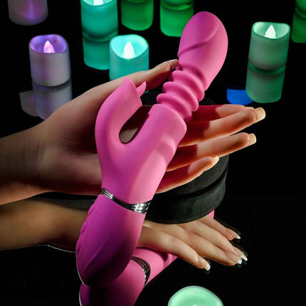 female Hand holding Evolved PINK DRAGON Thrusting Rabbit Vibrator